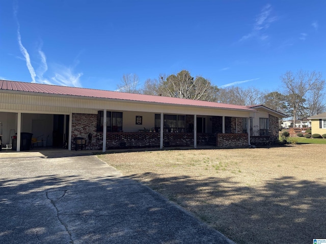 back of property featuring a carport