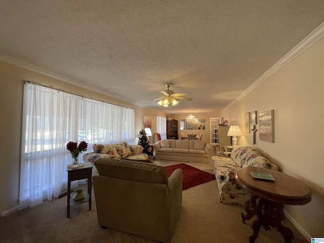 carpeted living room with ornamental molding, ceiling fan, and a textured ceiling