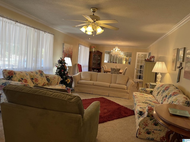 carpeted living room with crown molding, ceiling fan with notable chandelier, and a textured ceiling