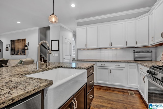 kitchen with white cabinetry, sink, dark hardwood / wood-style flooring, and gas range oven