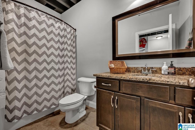 bathroom featuring walk in shower, vanity, and toilet