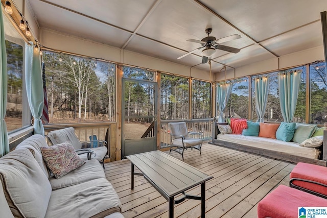 sunroom / solarium featuring coffered ceiling and ceiling fan