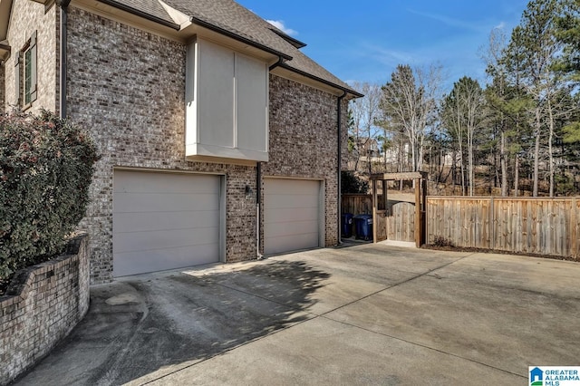 view of side of home featuring a garage