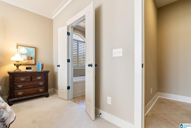 corridor featuring crown molding and light carpet