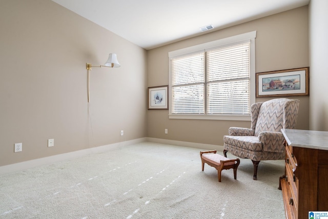 living area featuring carpet flooring