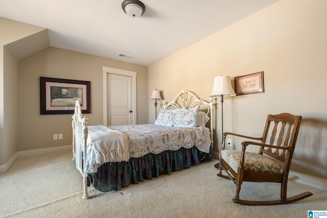 bedroom with lofted ceiling and carpet