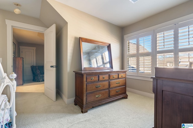 bedroom featuring light colored carpet