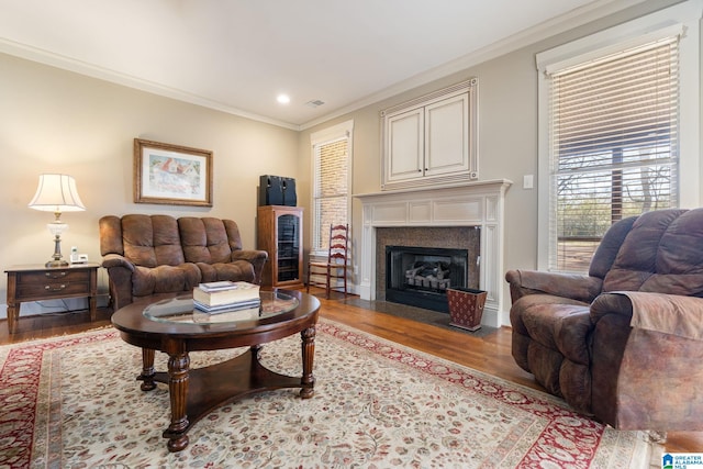 living room featuring ornamental molding and light wood-type flooring