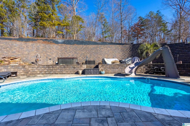 view of pool featuring a water slide