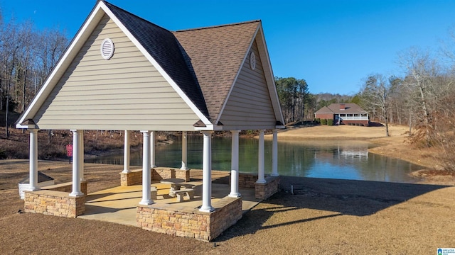 view of dock featuring a gazebo and a water view