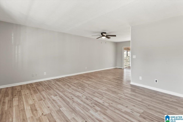 empty room featuring ceiling fan and light wood-type flooring