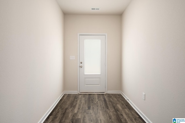 entryway with dark wood-type flooring