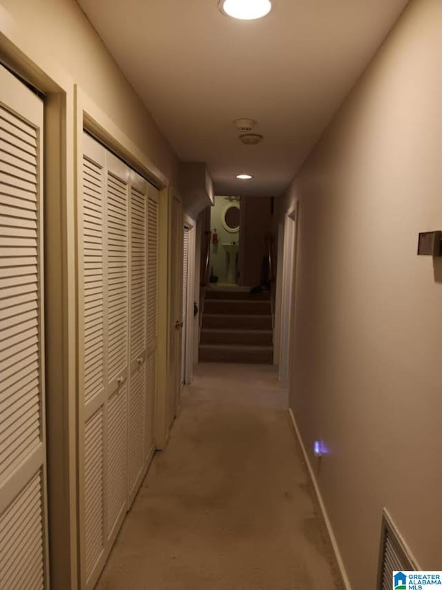 corridor with light colored carpet