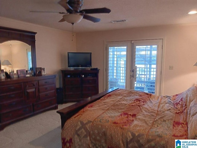 carpeted bedroom featuring crown molding, access to exterior, and ceiling fan