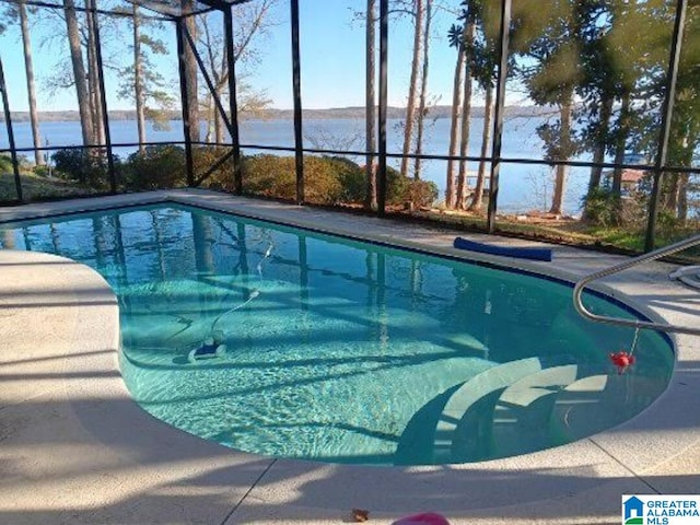 view of pool with a water view