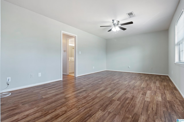 unfurnished room with ceiling fan and dark hardwood / wood-style flooring