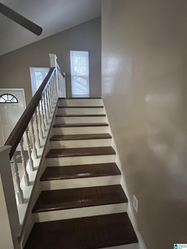 stairway with lofted ceiling