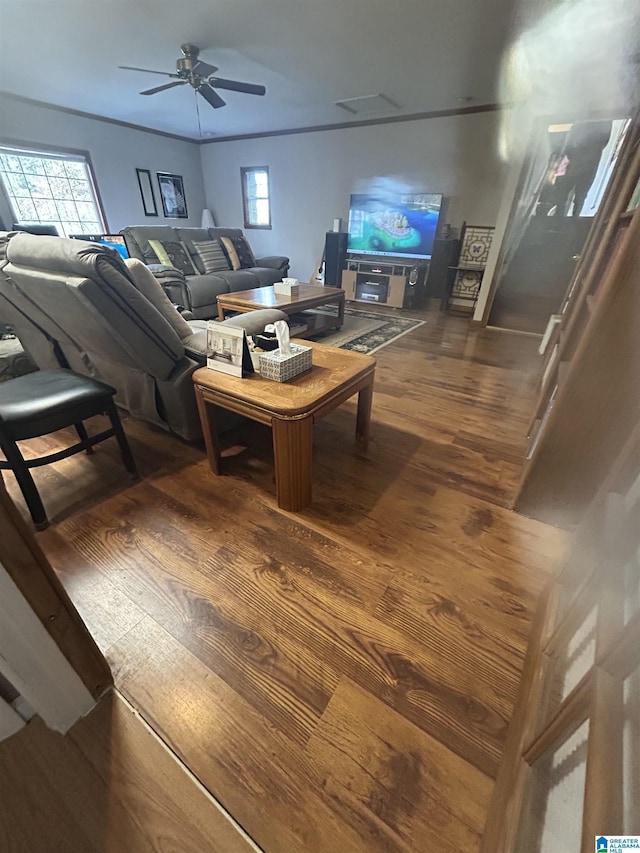 living room featuring hardwood / wood-style flooring and ceiling fan