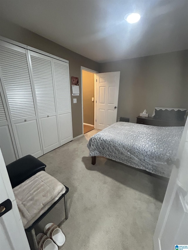 carpeted bedroom with a closet