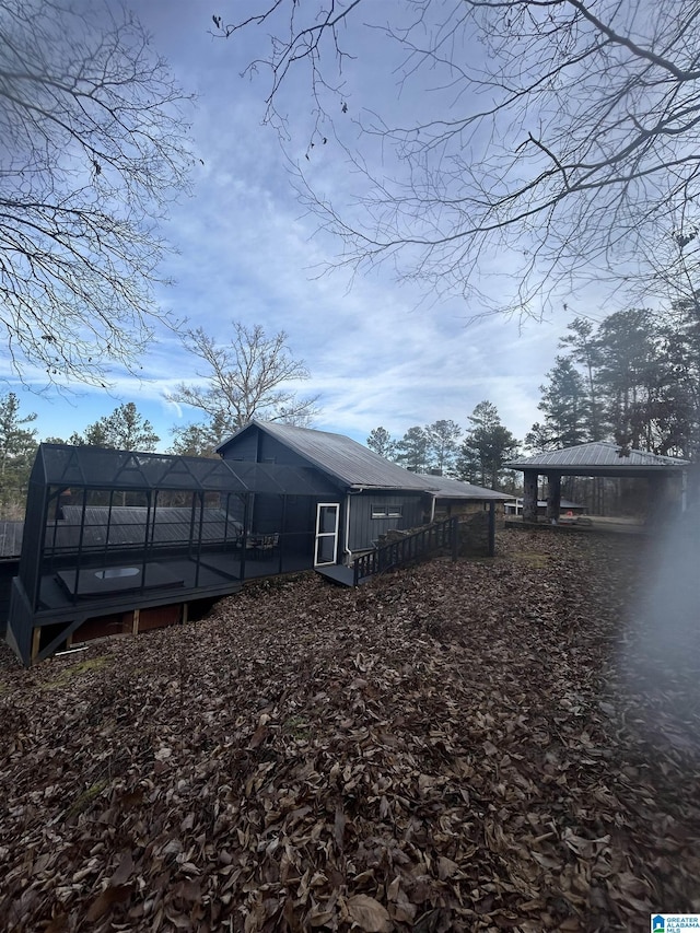 rear view of house featuring a carport