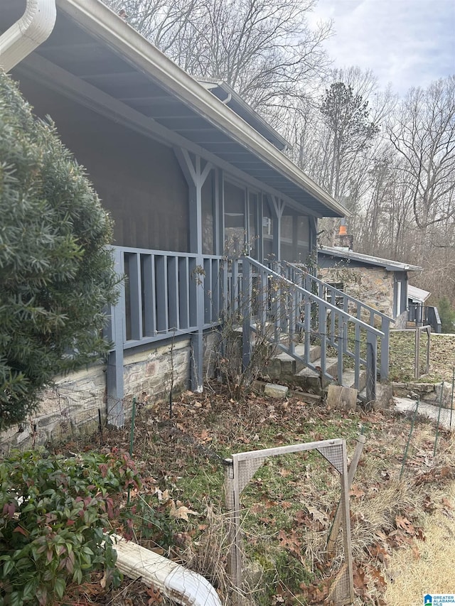 view of side of property with a sunroom