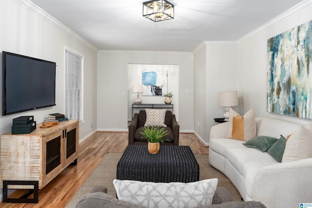 living room featuring hardwood / wood-style flooring and ornamental molding