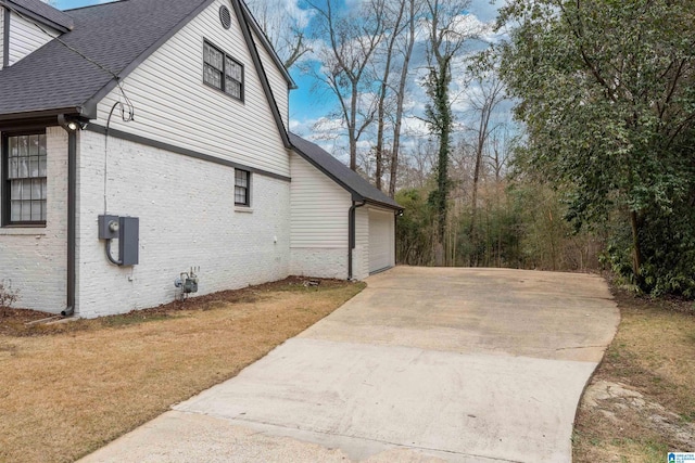 view of side of property featuring a garage