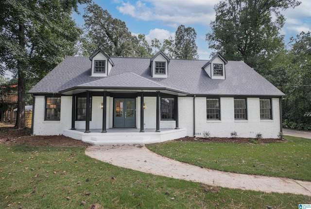 view of front facade featuring a front lawn and covered porch