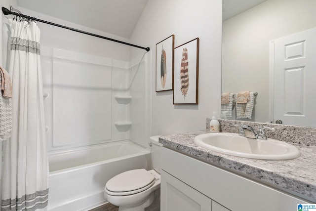 bathroom featuring toilet, shower / tub combo, vaulted ceiling, and vanity