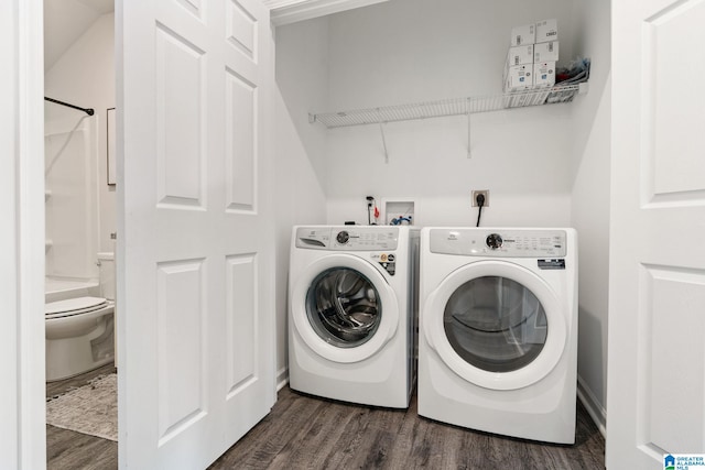 laundry room featuring laundry area, dark wood finished floors, and washer and dryer