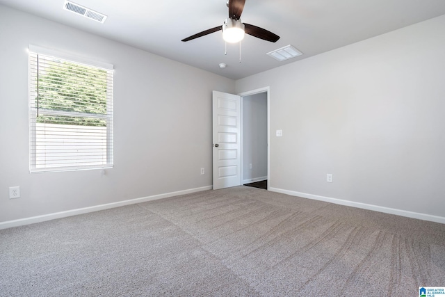 carpeted empty room with ceiling fan