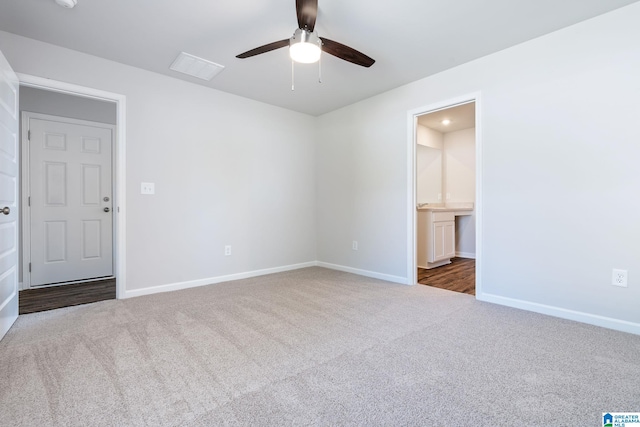 unfurnished room with ceiling fan and carpet