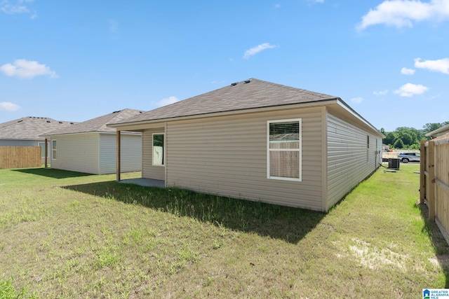 rear view of house with a lawn