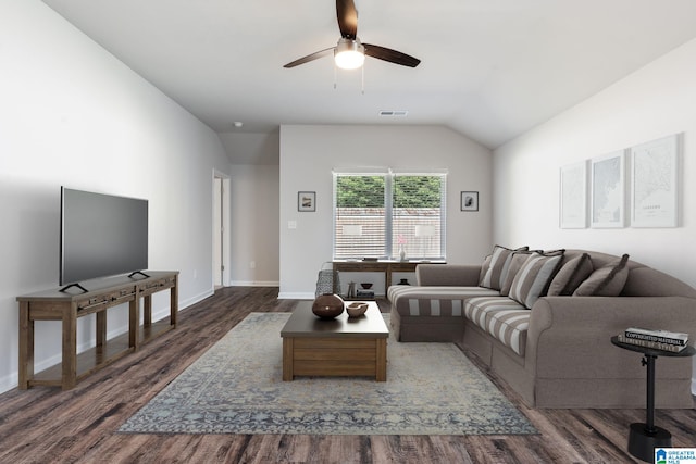 living room with dark wood-type flooring, ceiling fan, and lofted ceiling