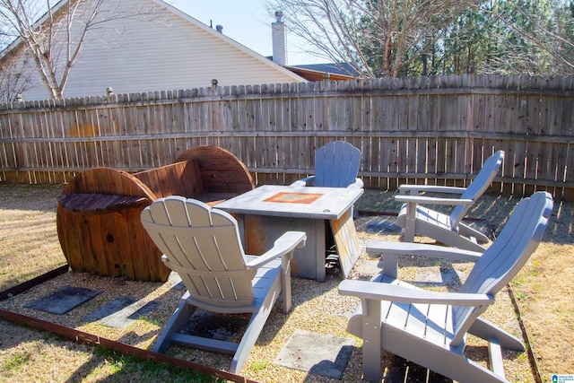 view of patio with a fire pit