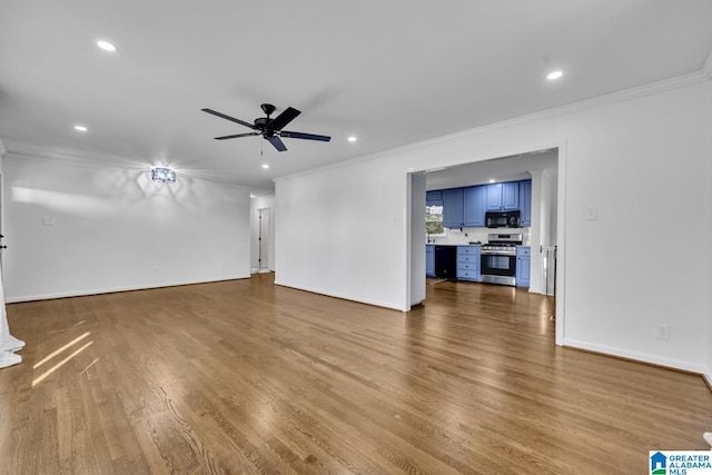 unfurnished living room with ornamental molding, wood-type flooring, and ceiling fan