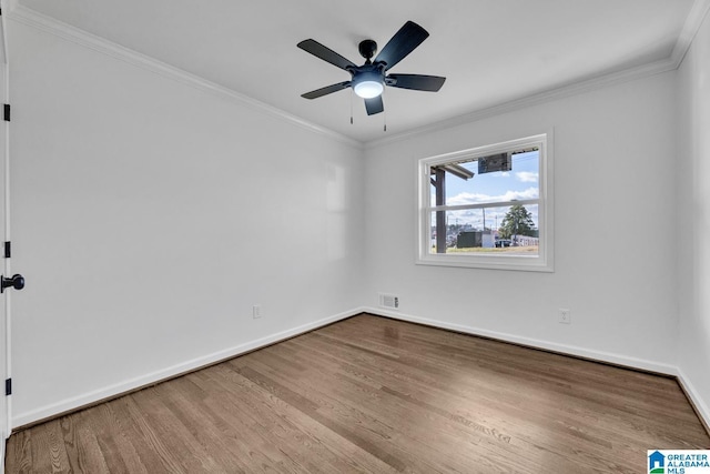 unfurnished room featuring ornamental molding, ceiling fan, and light wood-type flooring