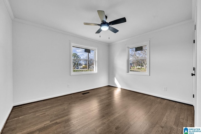 spare room with crown molding, ceiling fan, and dark hardwood / wood-style floors