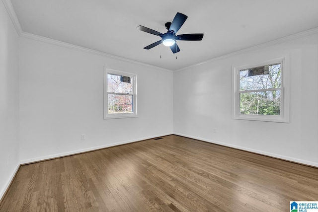 spare room featuring crown molding, ceiling fan, and hardwood / wood-style flooring