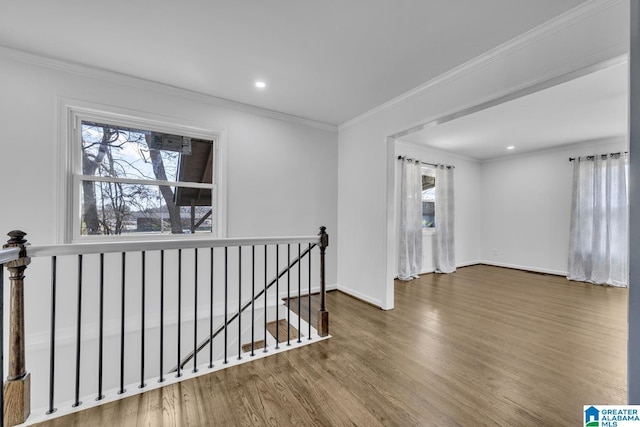 empty room with crown molding and dark hardwood / wood-style flooring