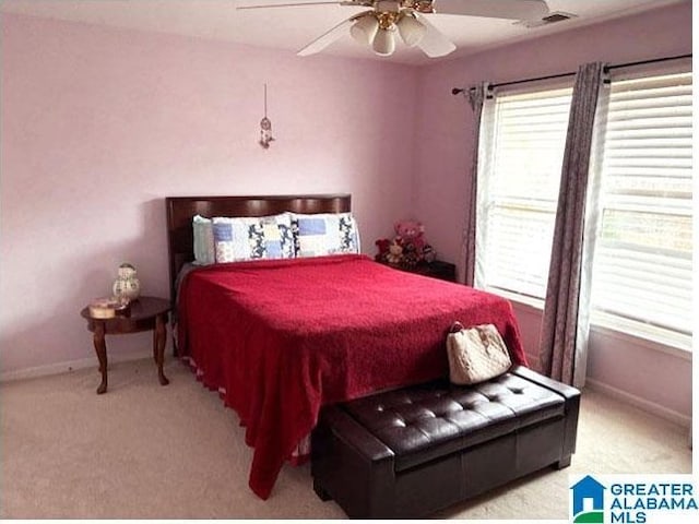 carpeted bedroom featuring ceiling fan