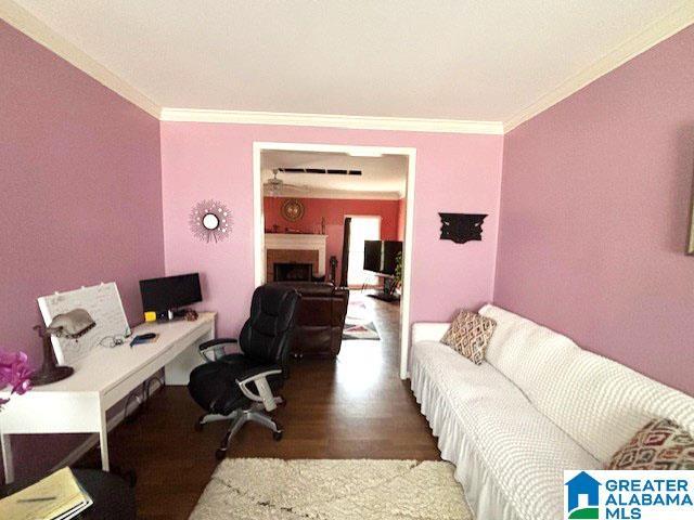 office featuring hardwood / wood-style flooring and crown molding