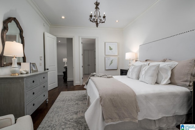 bedroom featuring crown molding, dark hardwood / wood-style floors, and an inviting chandelier