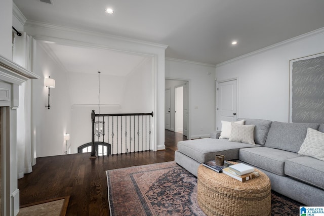 living room featuring ornamental molding, dark hardwood / wood-style flooring, and a notable chandelier