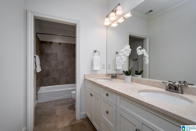 full bathroom with vanity, ornamental molding, tiled shower / bath, and toilet