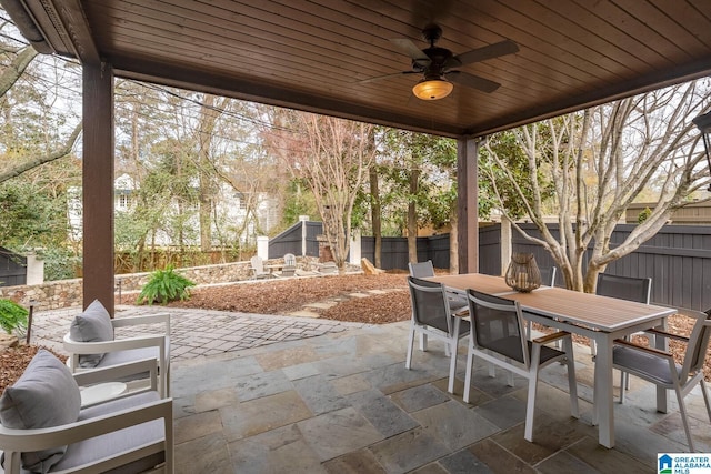 view of patio / terrace featuring ceiling fan and a storage unit