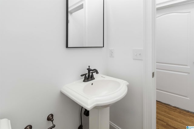 bathroom with sink and hardwood / wood-style floors