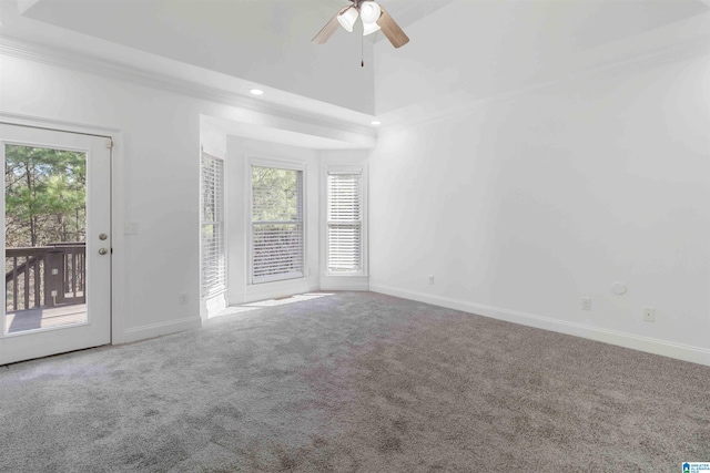 carpeted empty room featuring ornamental molding and ceiling fan