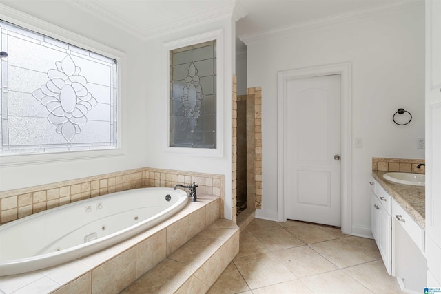 bathroom featuring tile patterned flooring, ornamental molding, tiled bath, and vanity