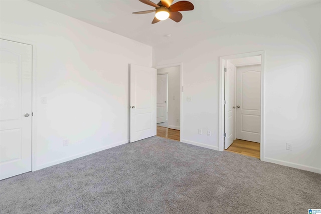 unfurnished bedroom with light carpet and ceiling fan